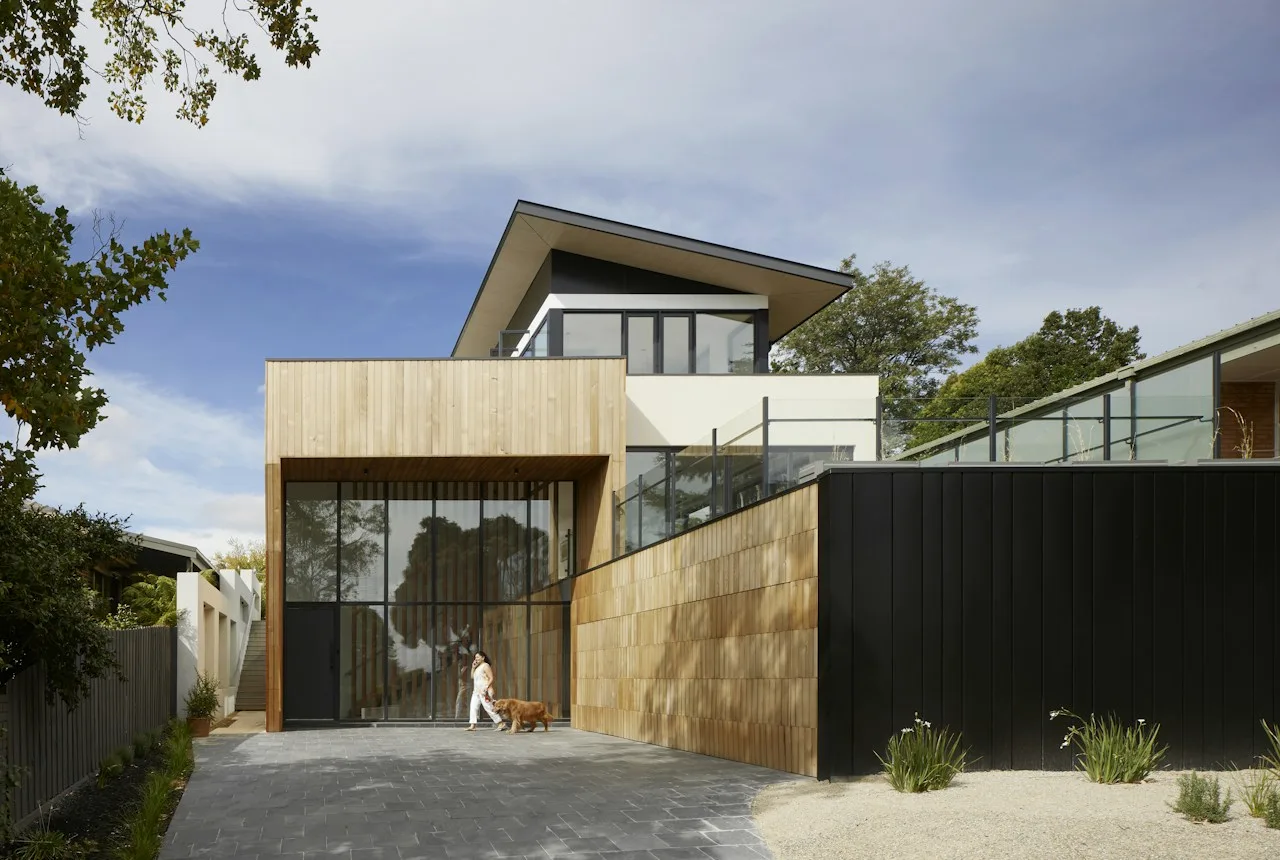 Contemporary Australian home exterior in warm timber and dark cladding